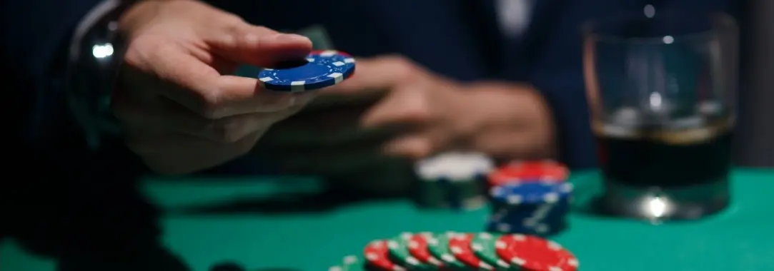 a player with chips on the table and three cards showing