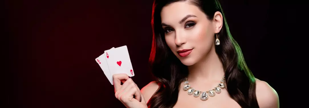 woman holding 2 aces