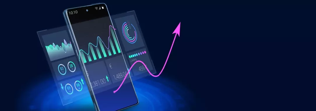 A photo of a smartphone and laptop with data and graphs on the respective displays isolated on a midnight blue background